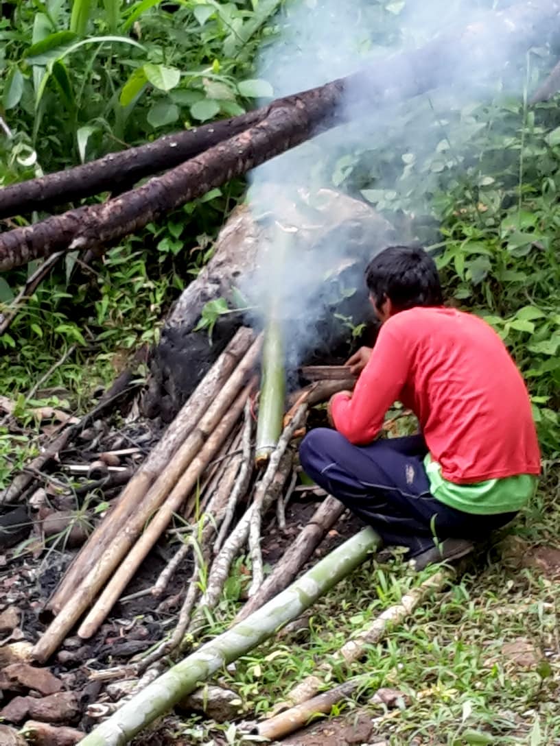Cooking tea in a bamboo cane